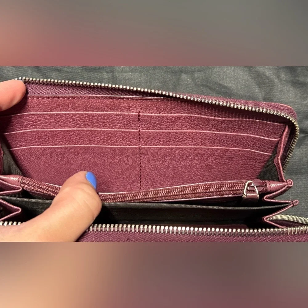YSL pink Cassandra studded zip around wallet